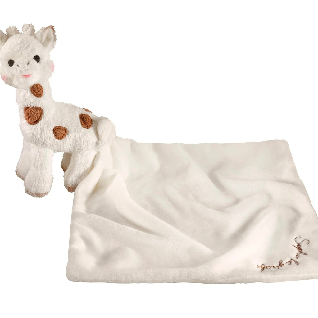 Plush giraffe toy comforter in a gift box with 'Sophie la girafe' branding.