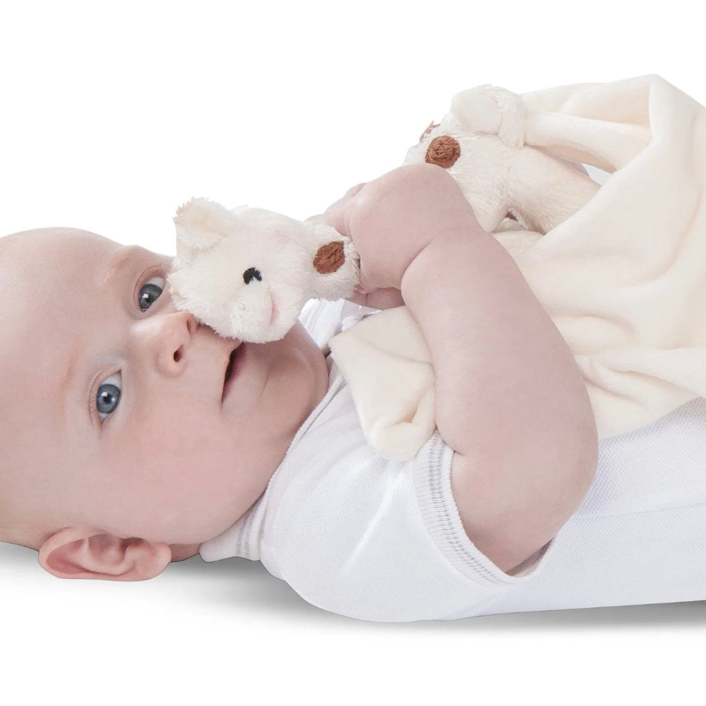 Plush giraffe toy comforter in a gift box with 'Sophie la girafe' branding.