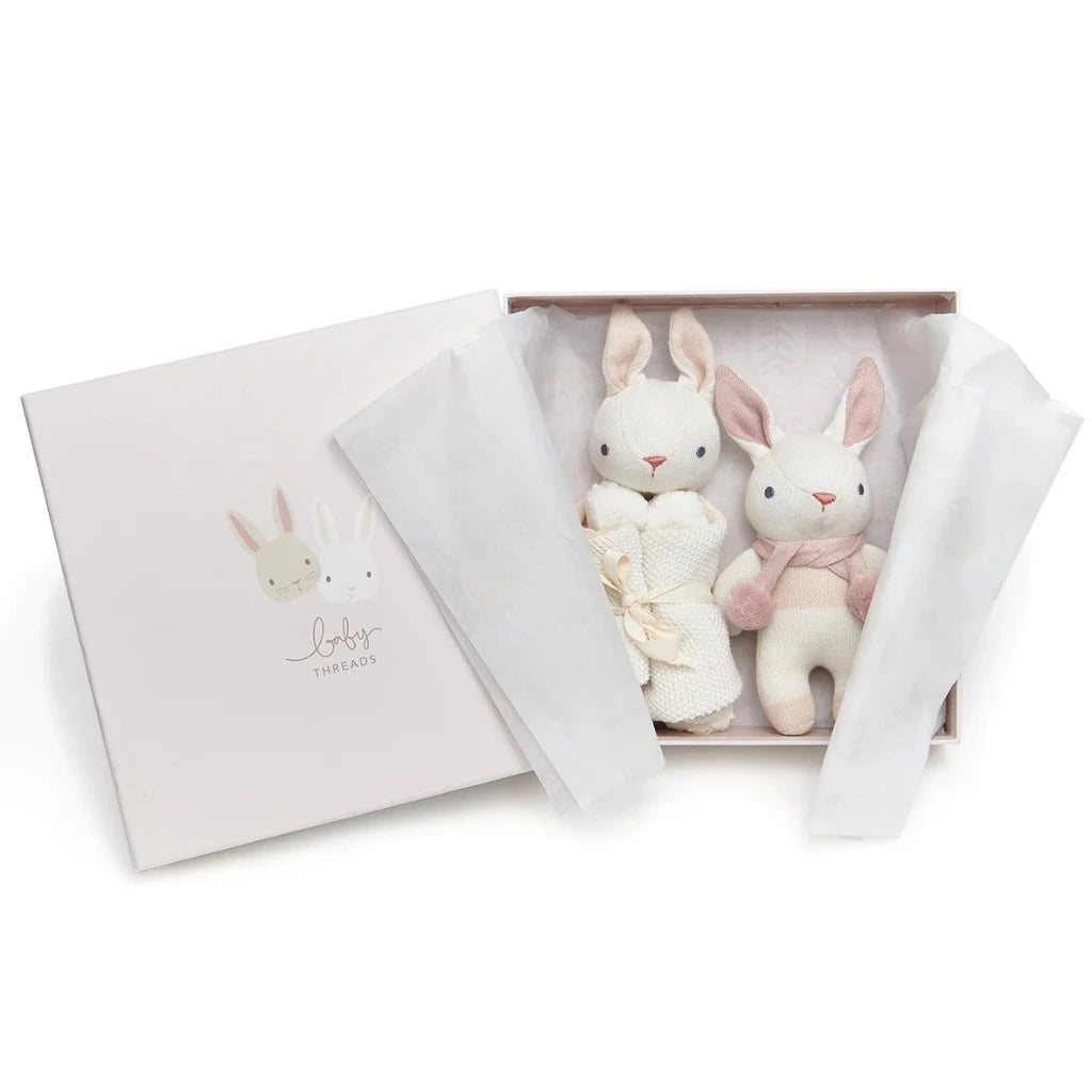 Organic baby soft knit toy in whote with pink clothing and matching bunny comforter