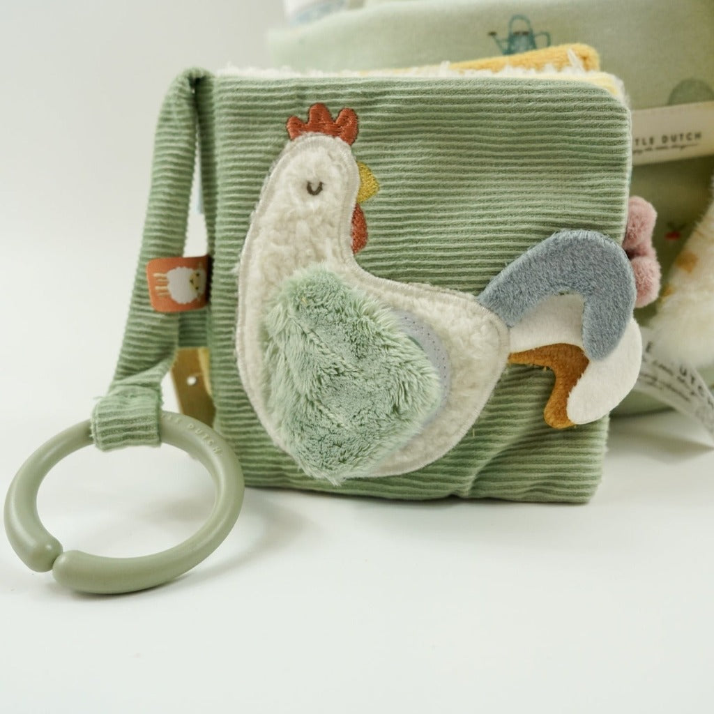 Little dutch farm basket in pale green, green little dutch blanket and farm green and plae green baby muslin, Harry and Rose organic baby lotion, Farm animals pram book in green, Lamb comforter and lamb soft toy