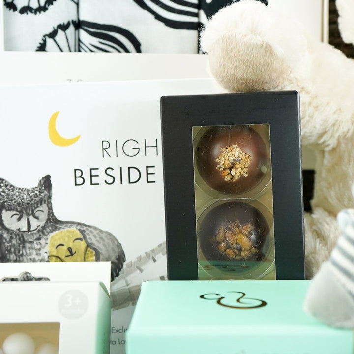 mum and baby sensory hamper , sensory book, 3 muslins in black and white, cream teddy, striped zebra soft rattle, sensory candle,