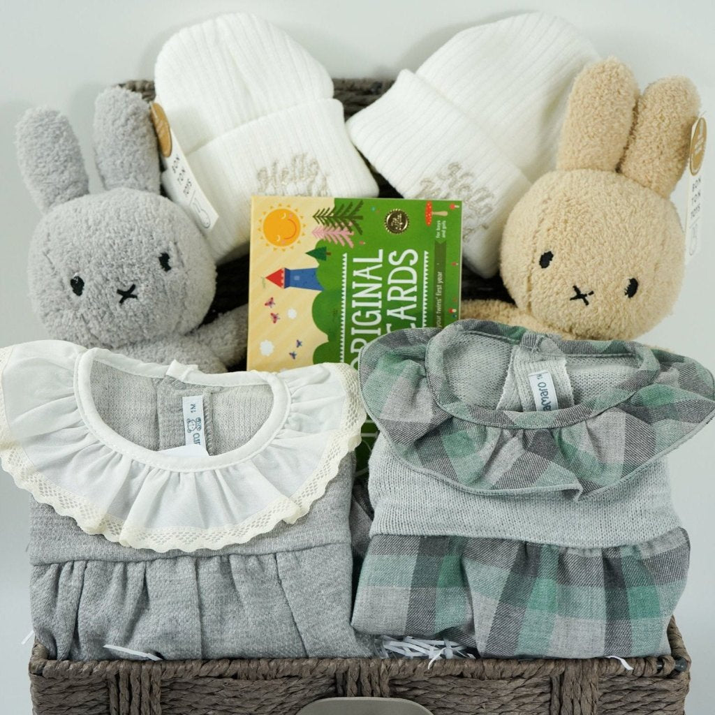 twin baby hamper  with 2 baby rompers in green and grey, white baby beanie hat, 2 x miffy one grey one biscuits colour, twins milestone cards