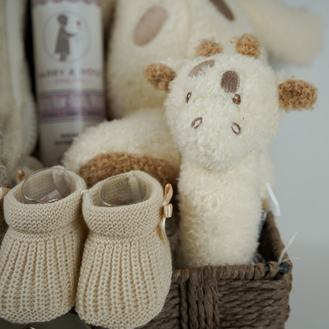 NEUTRAL BABY HAMPER, BABY BLANKET WITH HEARTS AND POMPOMS, BABY WASH, NATTOU GIRAFFE , GRAFFE RATTLE, BABY BOOTIES