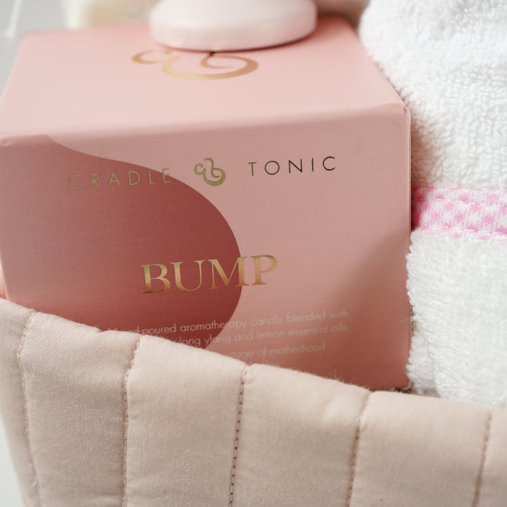 pink fairy floral quilted storage basket, reversible, white with pink flowers swaddle, white baby dressing gown with cute ears and pink and white gingham trim, bassinette quilt in pink, mama notes pregnancy diary, bump luxury mum candle, pink soft teddy, pink and grey maracas