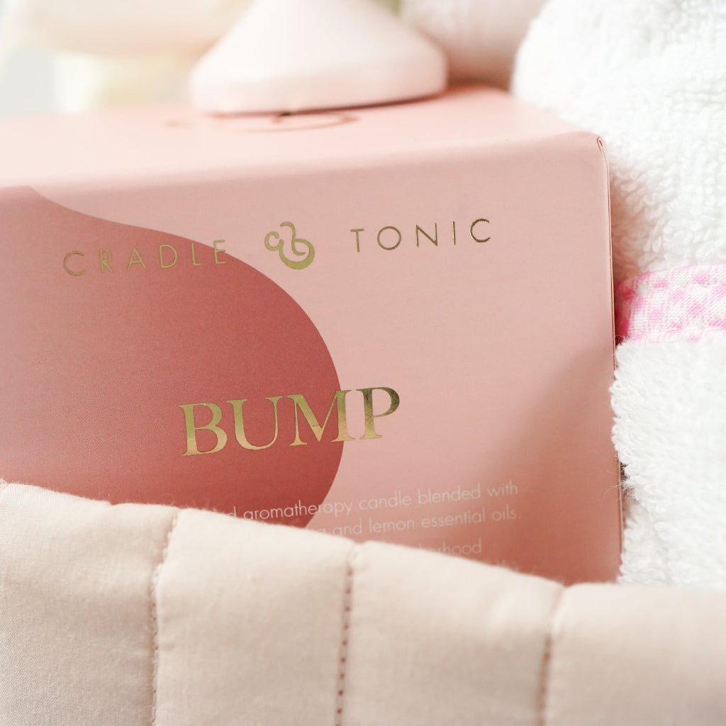 pink fairy floral quilted storage basket, reversible, white with pink flowers swaddle, white baby dressing gown with cute ears and pink and white gingham trim, bassinette quilt in pink, mama notes pregnancy diary, bump luxury mum candle, pink soft teddy, pink and grey maracas