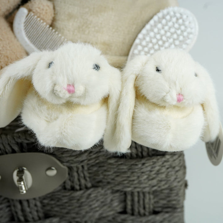 neutral baby gift hamper with  beige and caramel heart blanket with pompoms, baby dressing gown with cute ears, baby bunny slipper and matching bunny comforter, caramel miffy soft toy, chocolate spoon