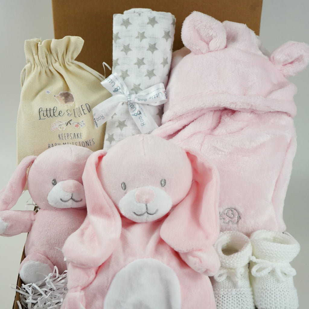 Baby hamper box includes pink bunny comforter and bunny soft toy, pink dressing gown , milestone baby discs and baby booties
