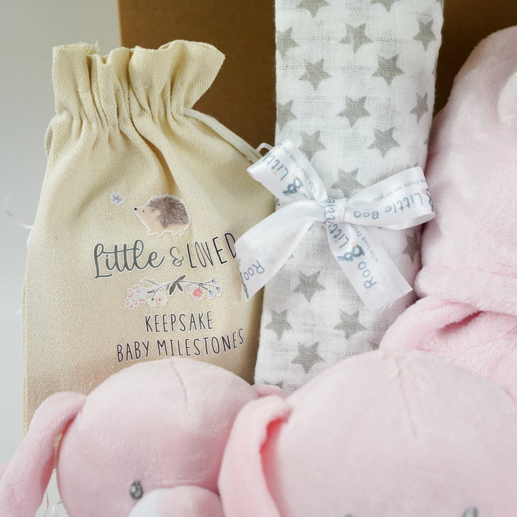 Baby hamper box includes pink bunny comforter and bunny soft toy, pink dressing gown , milestone baby discs and baby booties