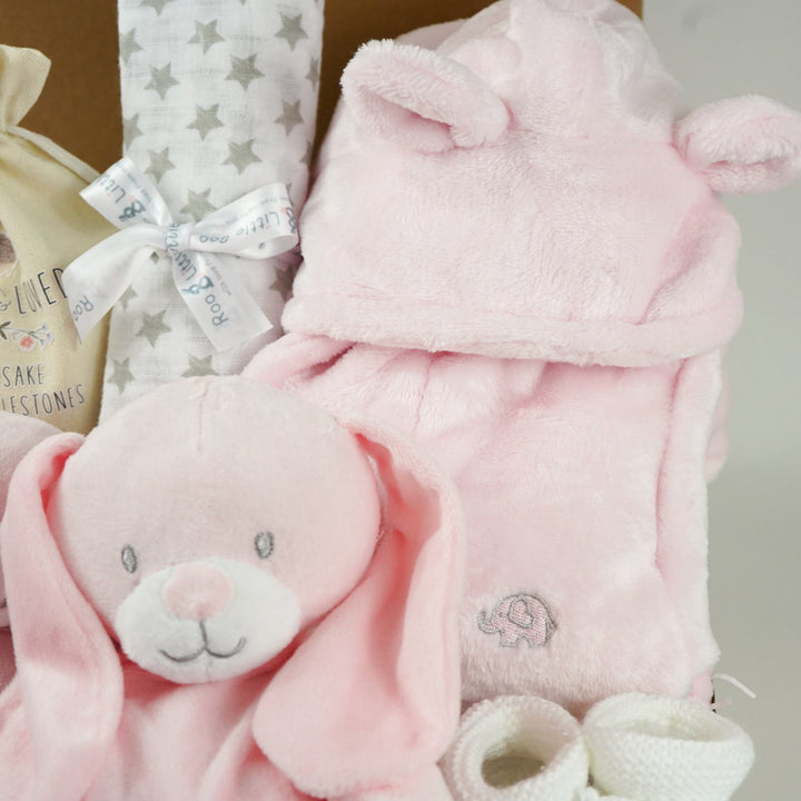 Baby hamper box includes pink bunny comforter and bunny soft toy, pink dressing gown , milestone baby discs and baby booties