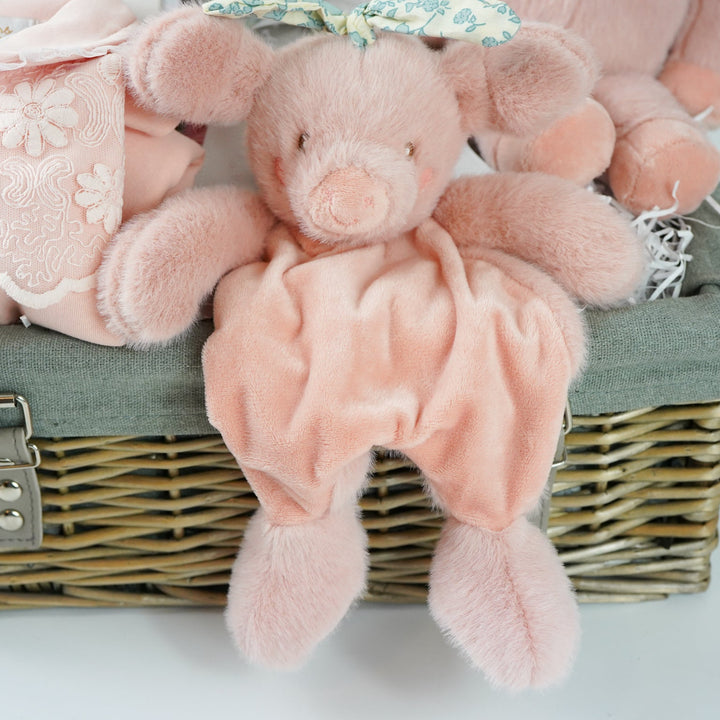 baby girl  hamper basket, pink pig baby comforter with chintz headband, pink pig soft toy with chintz headband, baby journal, organic baby toiletries, pink baby  bookies with a large bow,, Baby outfit -sleepsuit with lace chest area and matching hat in pink, soft luxury baby muslin swaddle with butterfly pattern, baby blanket in pink, white and green stripe