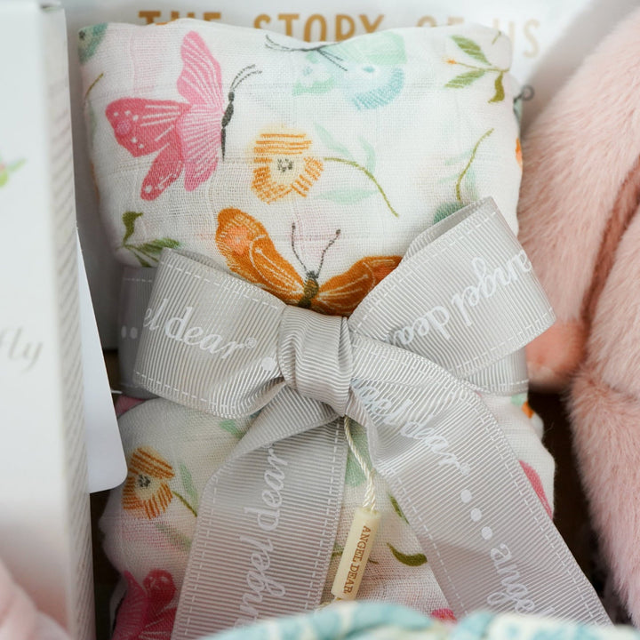 baby girl  hamper basket, pink pig baby comforter with chintz headband, pink pig soft toy with chintz headband, baby journal, organic baby toiletries, pink baby  bookies with a large bow,, Baby outfit -sleepsuit with lace chest area and matching hat in pink, soft luxury baby muslin swaddle with butterfly pattern, baby blanket in pink, white and green stripe