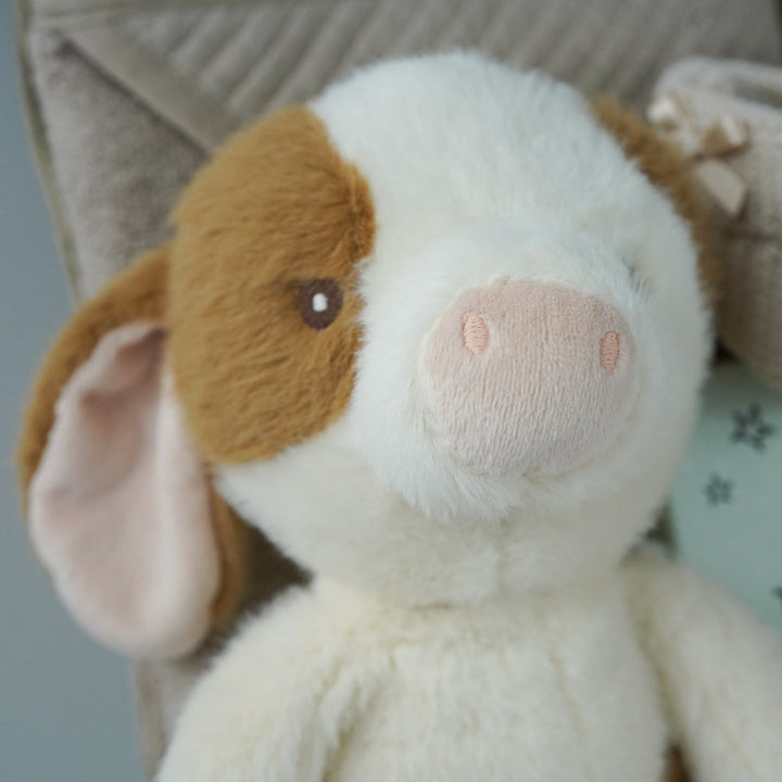 cow themed baby hamper with cow soft toy, comforter and rattle, farmyard soft blocks , baby milestone cards soft biscuit coloured hooded bath towel and knitted booties