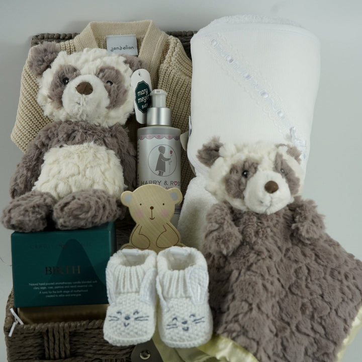 neutral baby hamper with grey and white panda soft teddy and matching baby comforter, cute white baby booties with ears and face, baby wooden push along toy,  baby toiletries, soft hooded towel