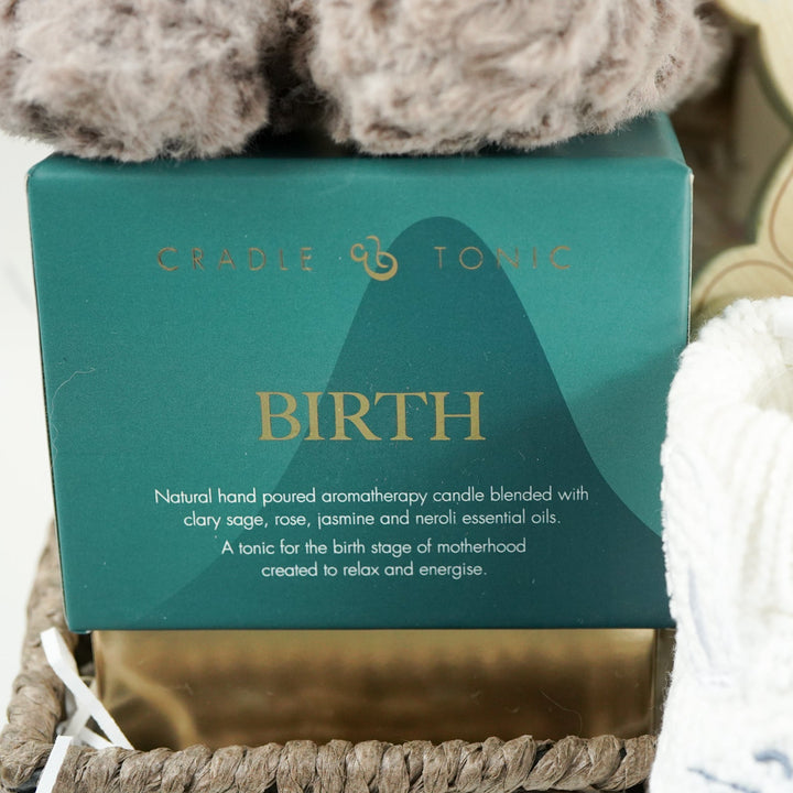 neutral baby hamper with grey and white panda soft teddy and matching baby comforter, cute white baby booties with ears and face, baby wooden push along toy,  baby toiletries, soft hooded towel , luxury birth candle