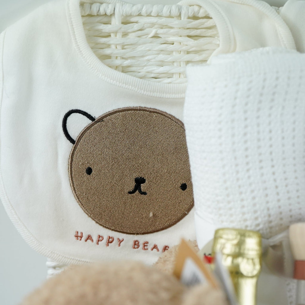 teddy themed baby hamper with teddy and matching comforter and musical teddy, cream with teddy face layette set, no alcohol frixenet , cellular blanket, baby booties and wooden ended rain maker