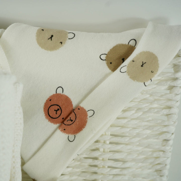 teddy themed baby hamper with teddy and matching comforter and musical teddy, cream with teddy face layette set, no alcohol frixenet , cellular blanket, baby booties and wooden ended rain maker