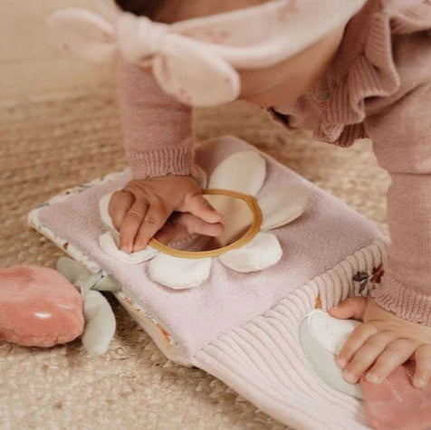 Pink soft baby sensory book with deer and fairy garden theme, full of pastel pink and green interactive images  and baby mirror