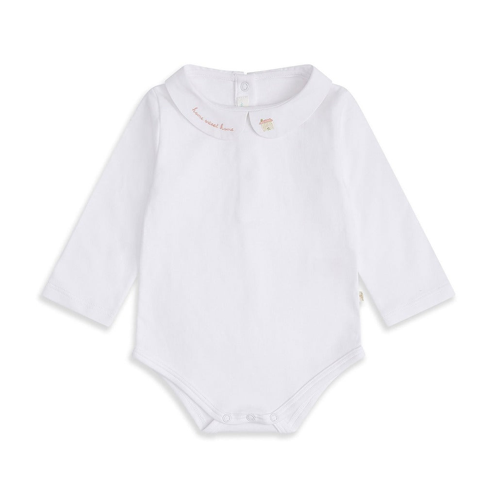 white onesie with home sweet home embroidered on one collar and a house on the other