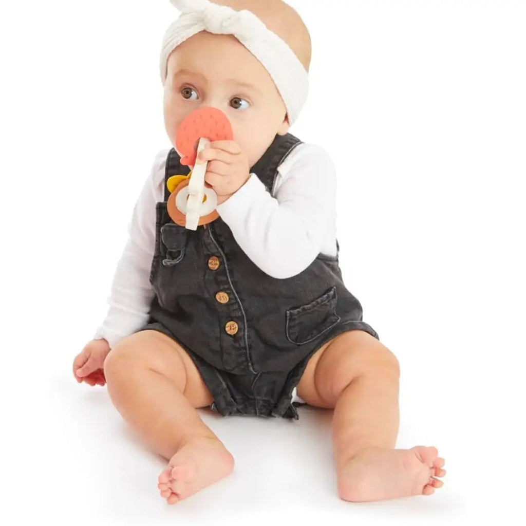Colorful baby teether with 'Sophie la girafe' branding on a white background