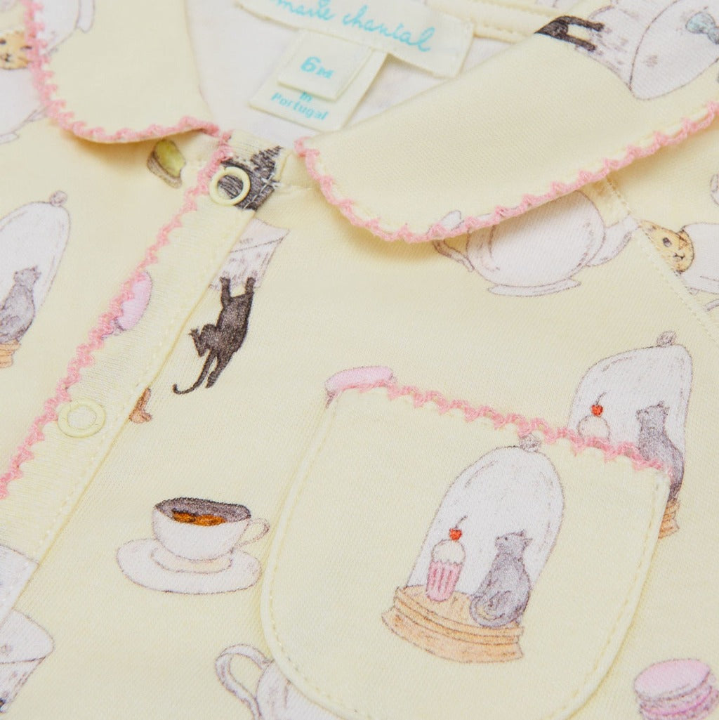 Vanilla coloured sleepsuit with pink picot edge and kittens