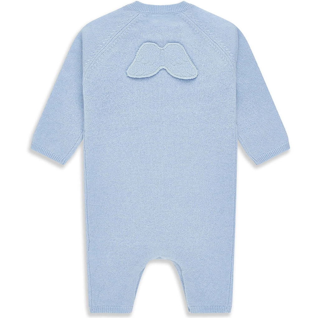 luxury baby keepsake case with luxury gifts, Steiff organic teddy with blue rompers , blue cashmere baby romper, baby toiletries organic, blue cotton blanket with star design, blue and white striped romper in organic cotton with embroidery on both sleeves, fluffy cream baby slip on slippers, wooden rattle with blue beads