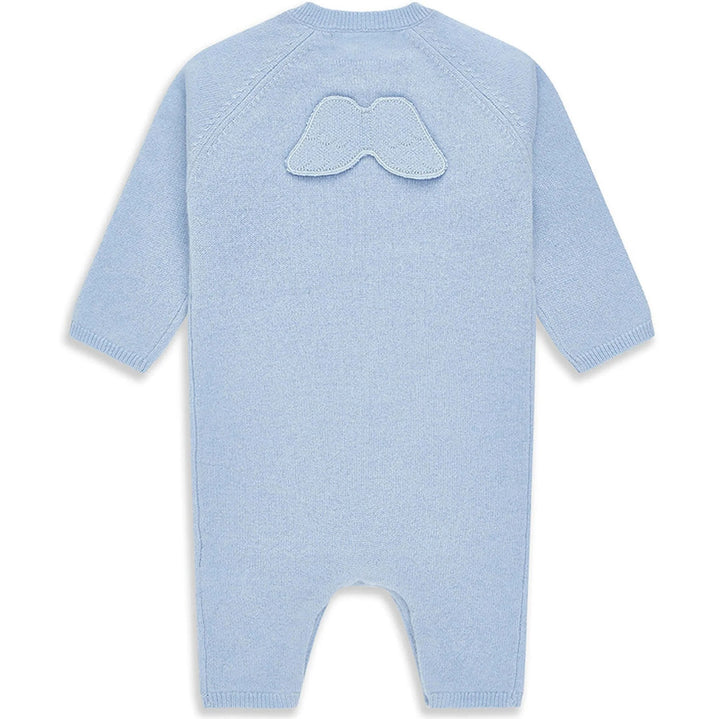 luxury baby keepsake case with luxury gifts, Steiff organic teddy with blue rompers , blue cashmere baby romper, baby toiletries organic, blue cotton blanket with star design, blue and white striped romper in organic cotton with embroidery on both sleeves, fluffy cream baby slip on slippers, wooden rattle with blue beads