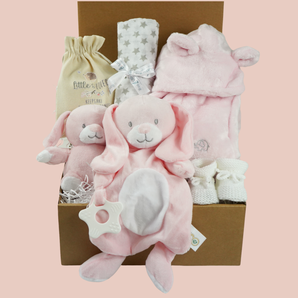 Baby hamper box includes pink bunny comforter and bunny soft toy, pink dressing gown , milestone baby discs and baby booties