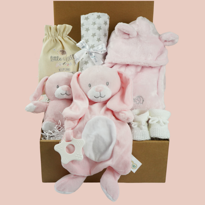 Baby hamper box includes pink bunny comforter and bunny soft toy, pink dressing gown , milestone baby discs and baby booties