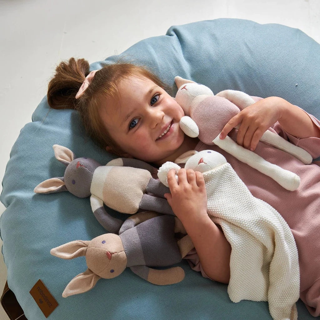 Organic grey knit baby soft toy with peach clothing and inner ears