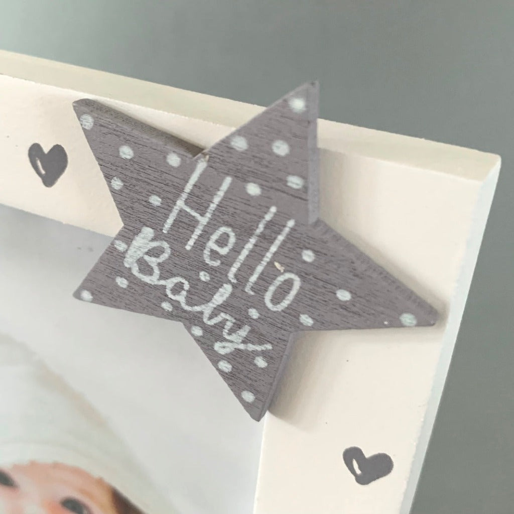 white baby picture frame with a grey elephant