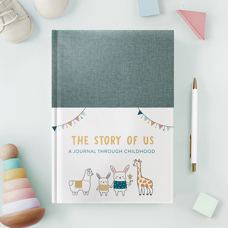 Green fabric covered baby journal