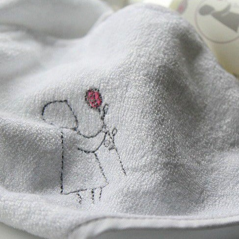 White gift box with organic baby toiletries, bamboo soft baby hooded towel in white with matching wash mitt