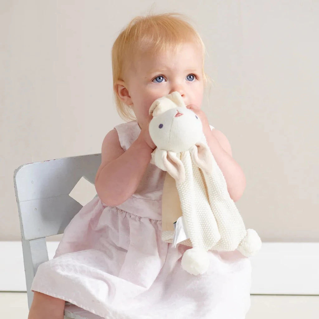 Cream organic knit baby bunny comforter with pom poms