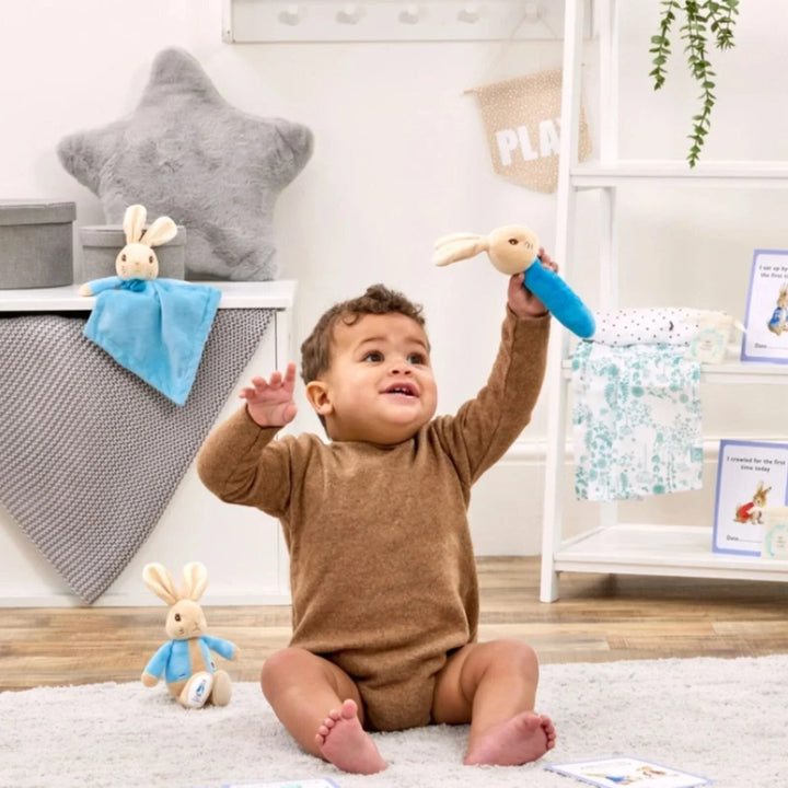 Peter rabbit gift keepsake box full of peter rabbit gifts including a blue peter rabbit comforter, soft toy and rattle, peter rabbit milestone cards