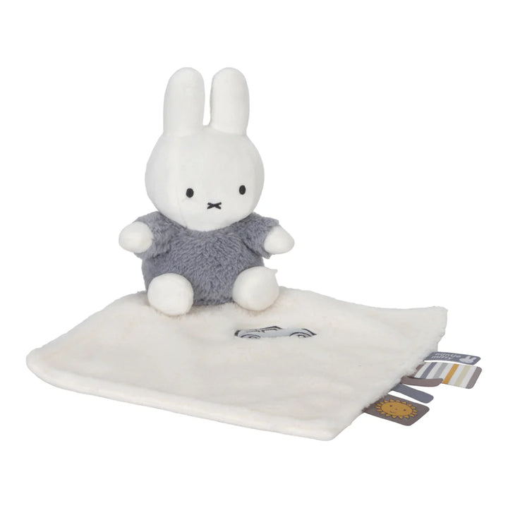 White miffy baby comforter , miffy sitting on cloth in blue fluffy outfit , taggies