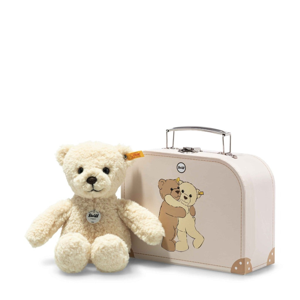 Cream teddy bear in a pink suitcase with teddies on