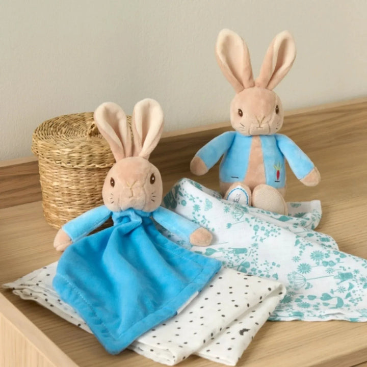 Peter rabbit gift keepsake box full of peter rabbit gifts including a blue peter rabbit comforter, soft toy and rattle, peter rabbit milestone cards