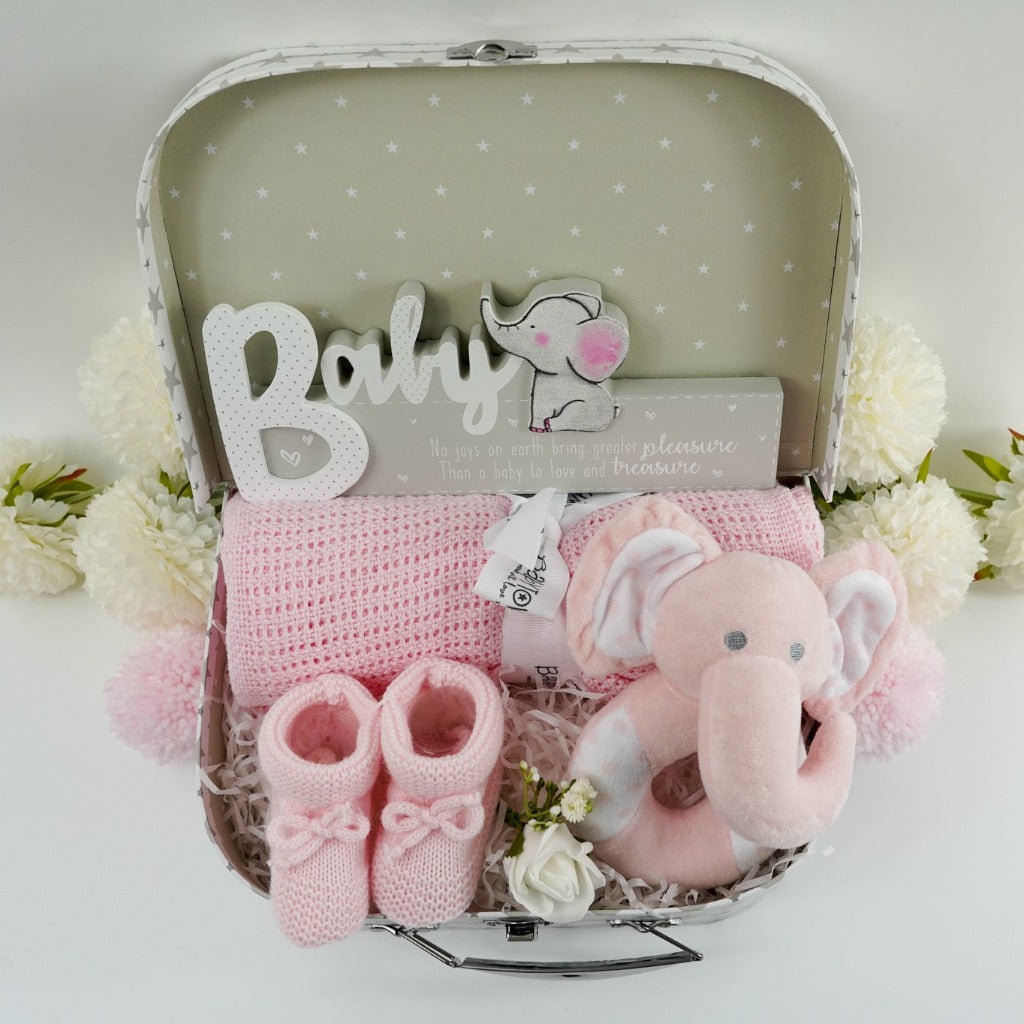 Pink elephant rattle, soft pink cellular blanket, bootees and nursery plaque in a gift case
