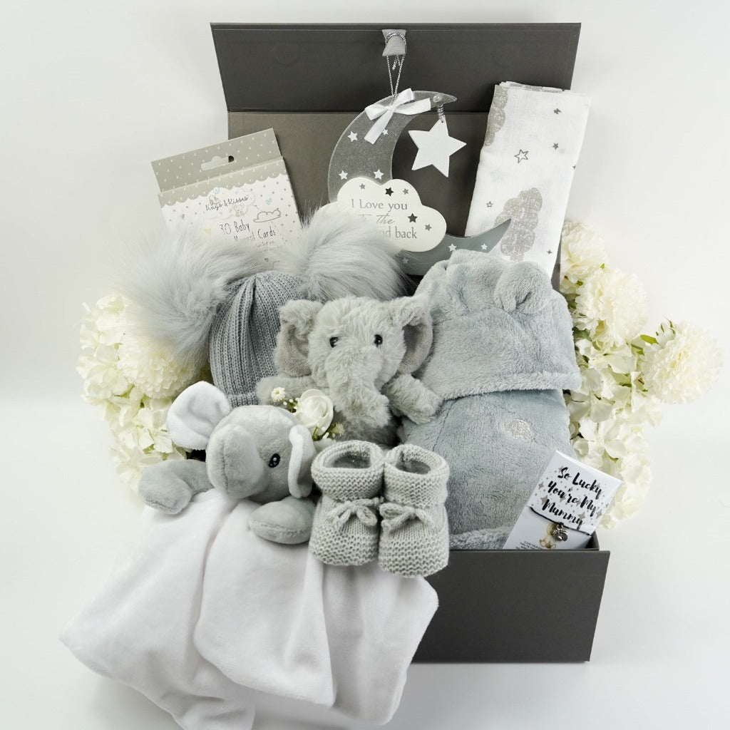 Grey baby dressing gown, grey baby double pom pom hat. grey  and white elephant comforter , grey and white baby muslin, grey elephant soft toy, moon hanging nursery plaque