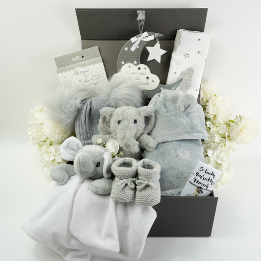 Grey baby dressing gown, grey baby double pom pom hat. grey  and white elephant comforter , grey and white baby muslin, grey elephant soft toy, moon hanging nursery plaque  