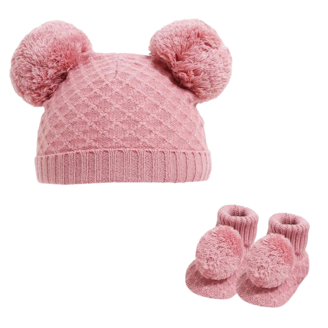 Pink baby hat with two poms and match baby bootees with pom pom