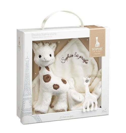 Plush giraffe toy comforter in a gift box with 'Sophie la girafe' branding.