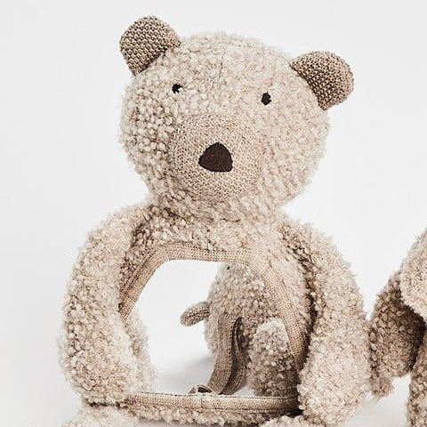 Textured teddy bear toy on a white background