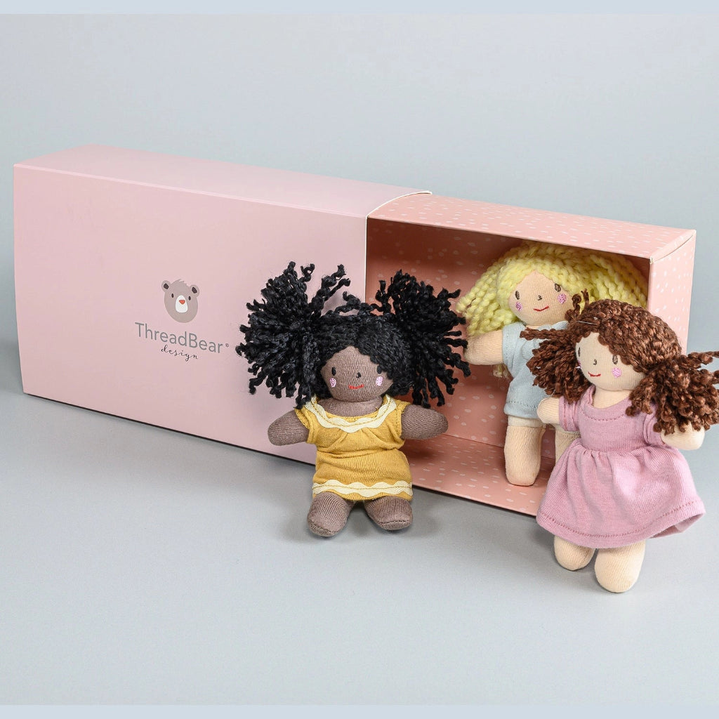 3 mini dolls in a box