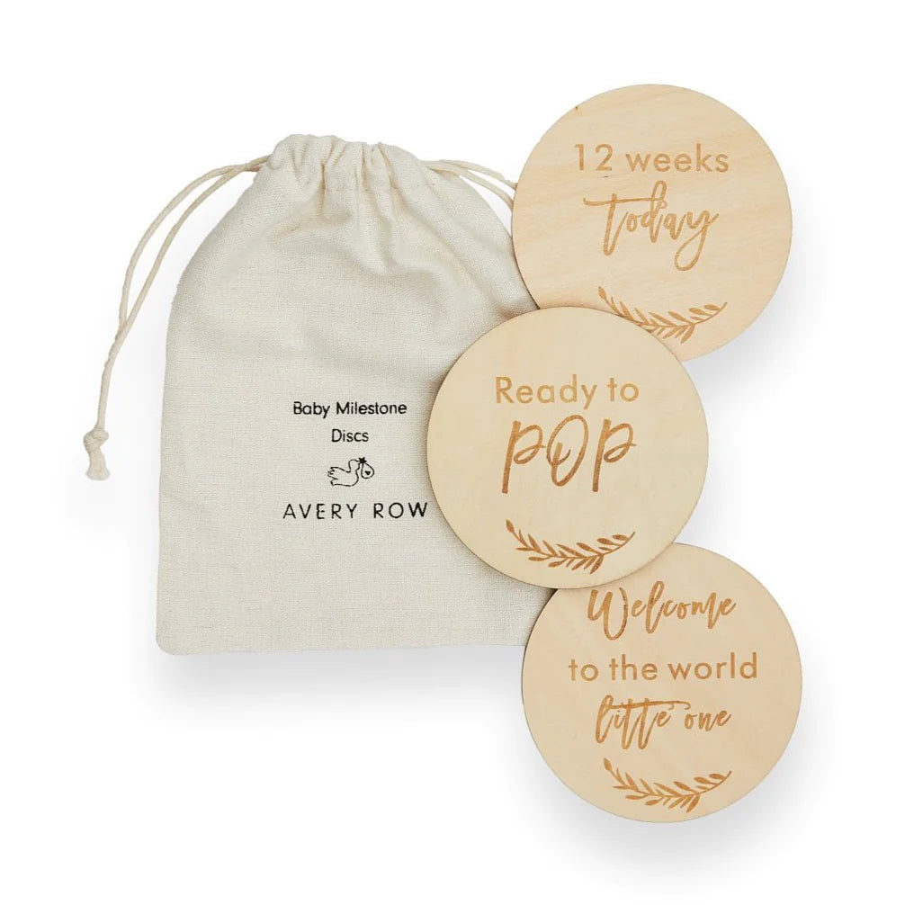 wooden pregnancy milestone discs in a  natural drawstring bag