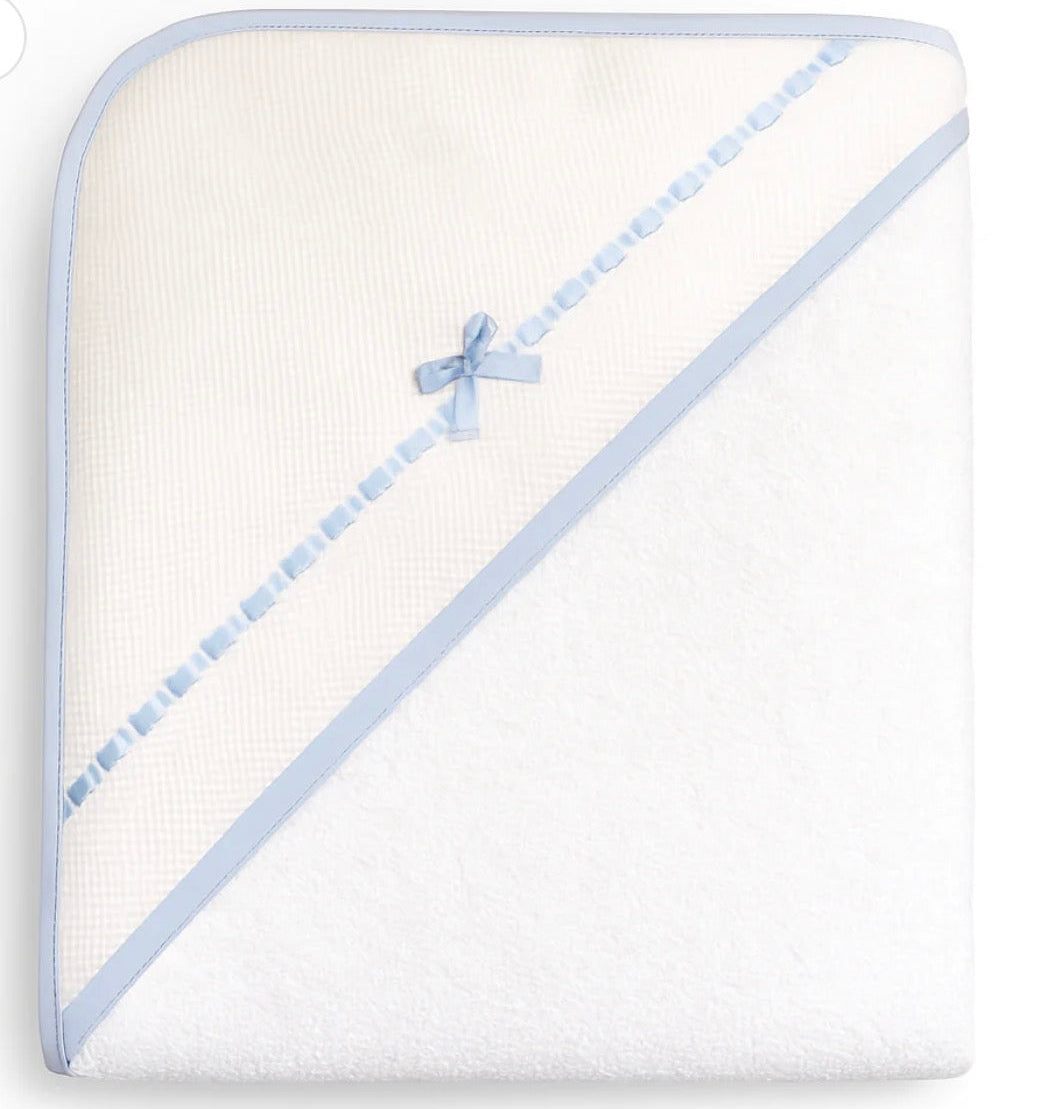 White hooded towel with blue trim and bow on a white background