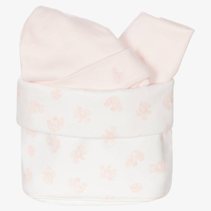 Pink baby girl sleepsuit with Ralph Lauren logo, pink baby bib with ralph lauren logo, pink organic cotton baby hat with ralph lauren logo, pink and white small basket in fabric by Ralph Lauren