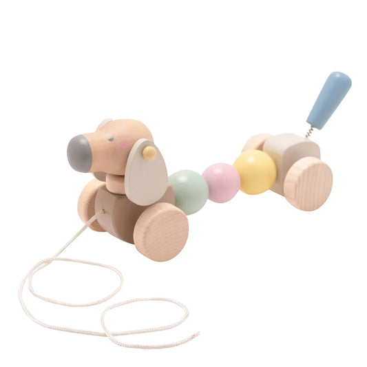 wooden sausage dog pull along toy in pastel colours 