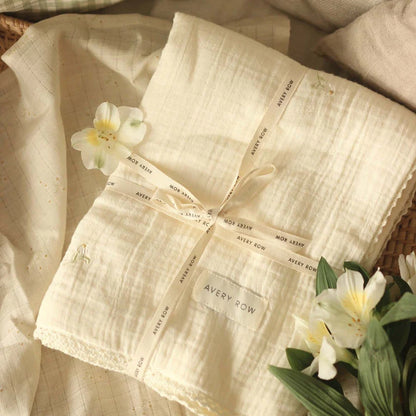 Organic Muslin baby blanket with delicate camomile embroidery