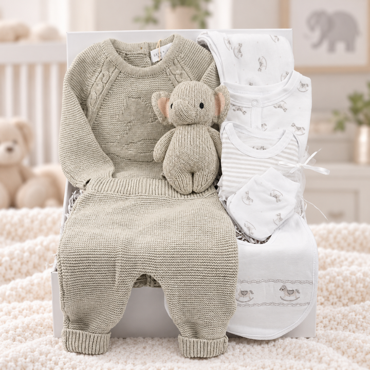 luxury baby hamper box includes a 2 piece cotton knit luxury baby 2 piece outfit with rocking horse design, 5 piece white cotton baby layette with rocking horse design, Cuddle + Kind knit elephant